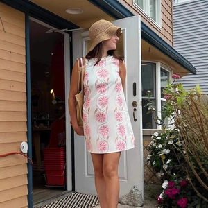 Women sleeveless white mini dress with pink floral prints for spring and summer