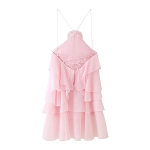 Close-up of pink halter neck ruffle dress with layered chiffon and tie-back detail