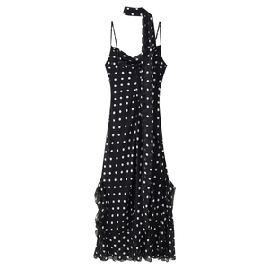 Polka dot sleeveless long dress with halter neck and ruffled hem for elegant spring fashion