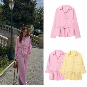 Detail of safari style shirt set with drawstring waist and pockets in pink and yellow