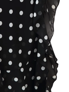 Detail of black polka dot sleeveless maxi dress with ruffles and sheer chiffon fabric