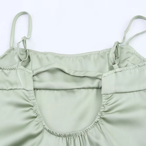 Elegant sage green satin slip dress with adjustable straps and open back detailing