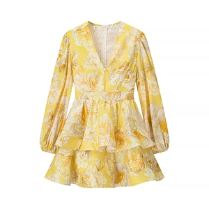 Floral yellow V-neck mini dress with puff sleeves and ruffled hem on white background