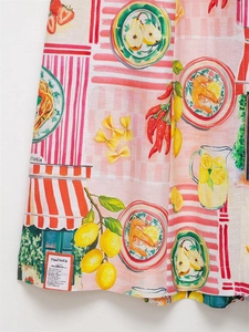 Detail of floral and Trattoria print on premium fabric with vibrant Mediterranean motifs