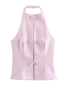 Sweet light pink halter neck top with delicate bow details for a feminine spring look