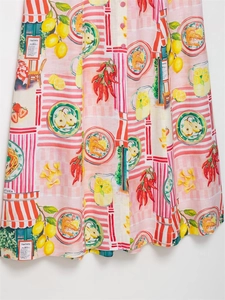 Detailed macro view of linen floral print featuring Italian trattoria scenes and lemons