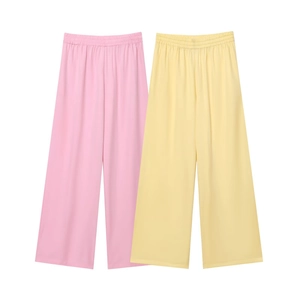 Close-up of lightweight wide-leg casual pants in soft pink and yellow pastel tones