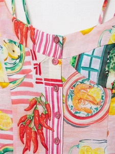 Detailed close-up of summer floral and seafood print on pink linen dress with buttons
