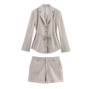 Detail of grey vertical striped blazer and matching shorts set with waist tie belt