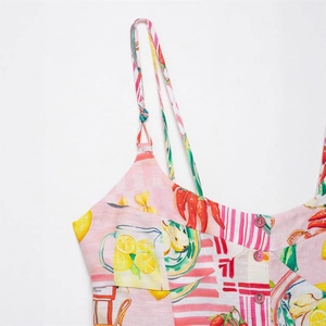 Detail of pink buttons and Mediterranean summer fruit print on a striped camisole top