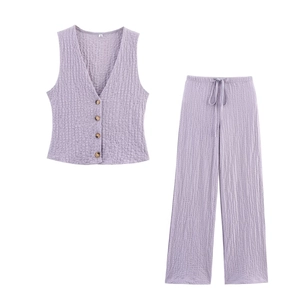 Flat lay of purple textured sleeveless vest and high waist wide leg pants set for women