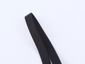 Detail shot of the elastic strap texture and black knit finish for the polka dot top