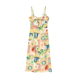 Detailed close-up of Mediterranean print floral dress with front bow and waist cutout design