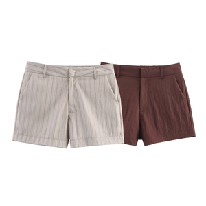 Detail view of high-waist striped grey and solid dark brown casual shorts for women