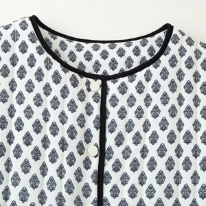 Quilted floral print jacket for women with round neck and black trim detail