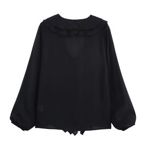 Back view of a black chiffon blouse featuring a delicate layered ruffle collar detail