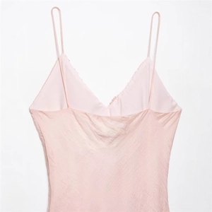 Elegant pink satin V-neck camisole dress with glossy finish and thin shoulder straps