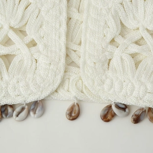 White crochet vest for women with shell tassel detailing and woven texture for spring fashion