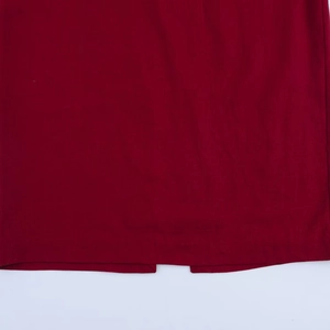 Deep burgundy linen asymmetric dress featuring a central slit detail on the woven hemline