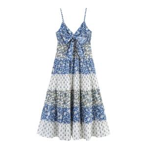 Blue and white floral patchwork tiered maxi dress with spaghetti straps and a bow