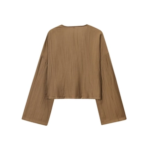 Close-up of brown long-sleeved pleated cropped top featuring vertical crinkle texture