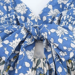 Floral patchwork spaghetti strap maxi dress featuring back bow tie and elastic ruching