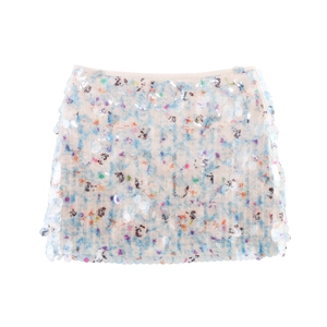 Close-up detail of beige mini skirt with shimmering sequins and floral printed lining