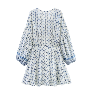 Blue and white geometric print V-neck dress with lantern sleeves and A-line silhouette