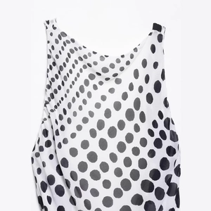 Elegant sleeveless polka dot maxi dress with a draped cowl neck and gradient print
