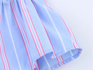 Close-up of tricolor vertical striped fabric showing blue white and pink neat stitching