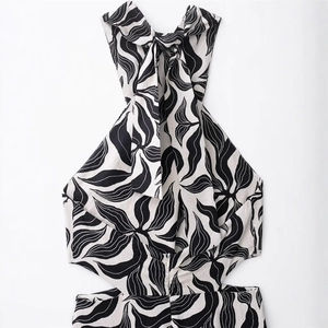 Detail of halter neck top with black and white botanical print and linen texture
