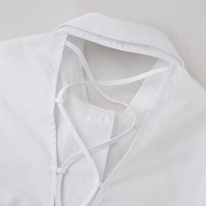 White cotton shirt with sharp collar and criss-cross tie-back design for women