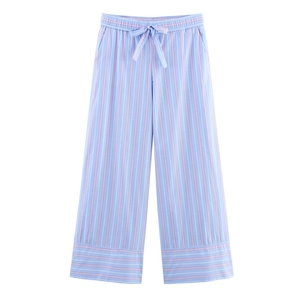 Detail of light blue striped lounge pants featuring elastic waist and adjustable drawstring