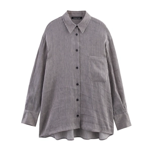 Close-up of linen blend striped shirt with black buttons and a large chest pocket