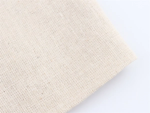 Vue macro détaillée de la texture du tissu en lin beige et du motif de tissage uni