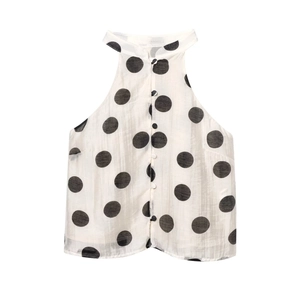 Polka dot halter neck sleeveless top with button front closure in retro white and black