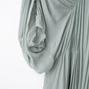 Elegant sage green pleated maxi dress for women featuring crinkled fabric and refined texture
