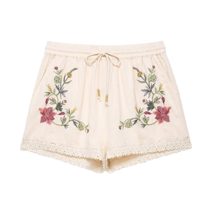 Women boho embroidered shorts with floral patterns and white lace trim in beige