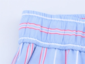Detail of light blue striped shorts showing the elastic waistband and fine stitching