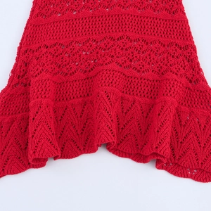 Red V-neck knit dress featuring pointelle patterns and delicate ruffle hem details