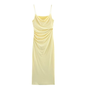 Elegant spaghetti strap cowl neck dress in light yellow satin with pleated design