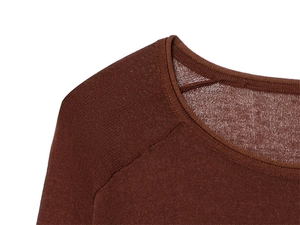 Detail of knit sweater crew neck and raglan sleeve seams in brownish-red fabric