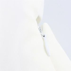 Close-up of the invisible zipper detail on white halter top with teardrop puller