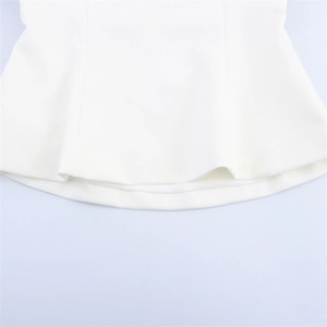 Macro detail of high-quality white fabric hem with smooth stitching and drape texture