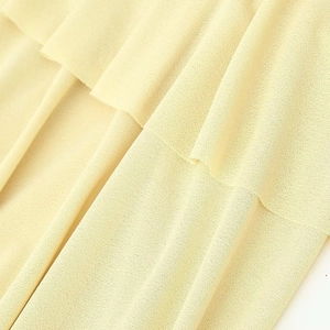 French vintage tiered midi dress in light yellow with delicate crinkled fabric texture