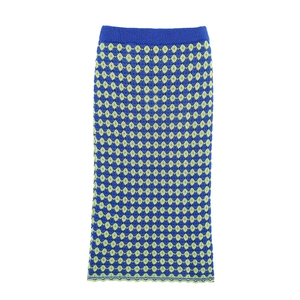 Detailed knit texture of vintage blue and green argyle pattern crochet skirt with elastic waist