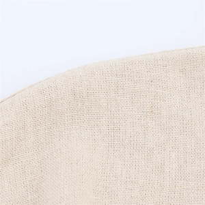 Close-up of the natural off-white linen fabric texture showing premium plain weave quality