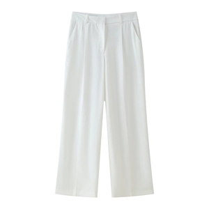 Detail of high-waisted white wide-leg trousers featuring front pleats and side pockets