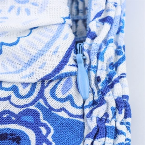 Close-up of blue print cotton linen fabric with hidden zipper detail on summer maxi dress