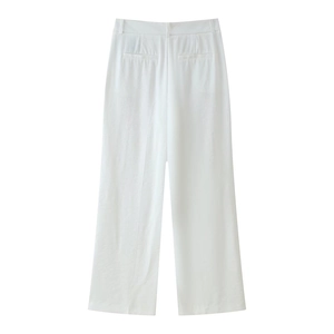 Macro view of white high-waist wide-leg pants showing rear faux pockets and fabric texture
